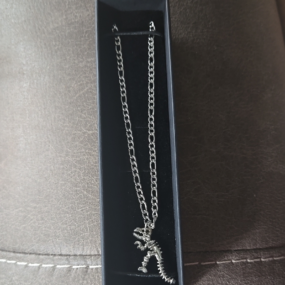 Stainless Dinosaur Pendant Stainless Figuro Necklace.